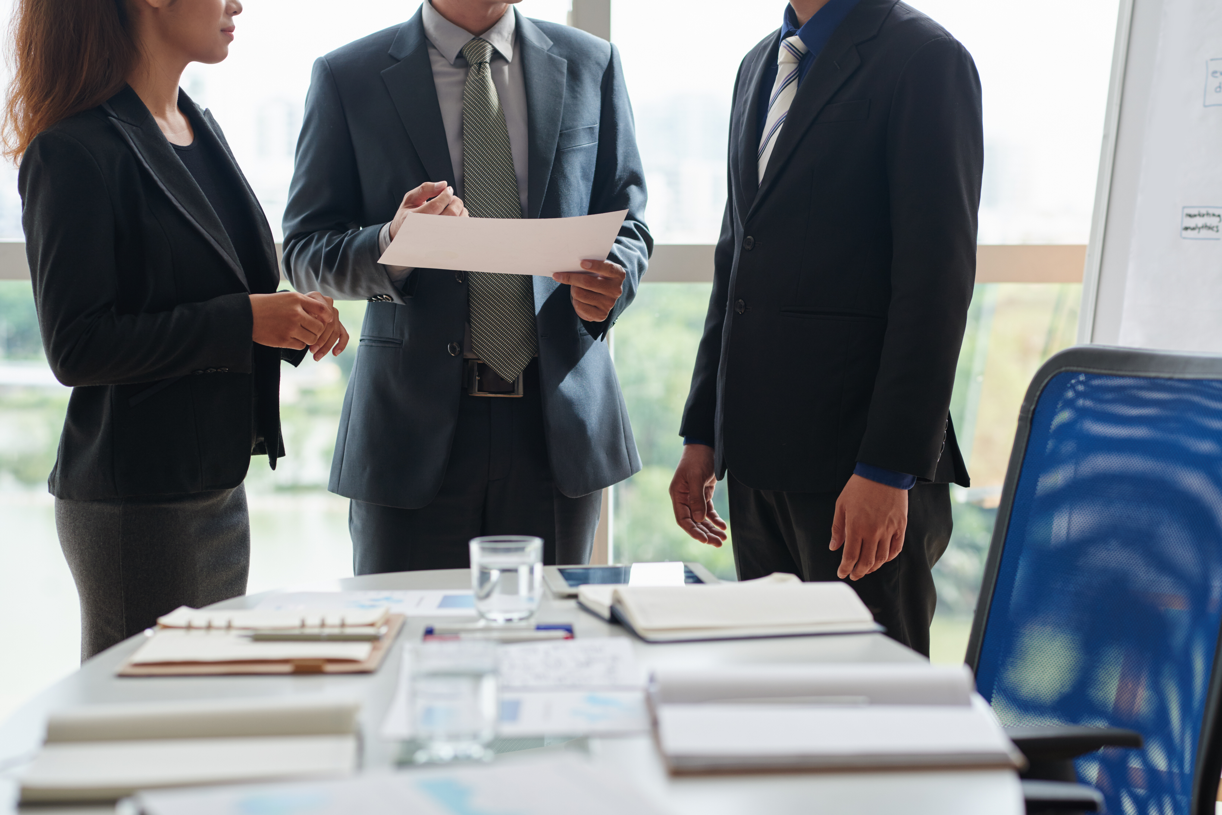 Small litigation firm team reviewing case documents